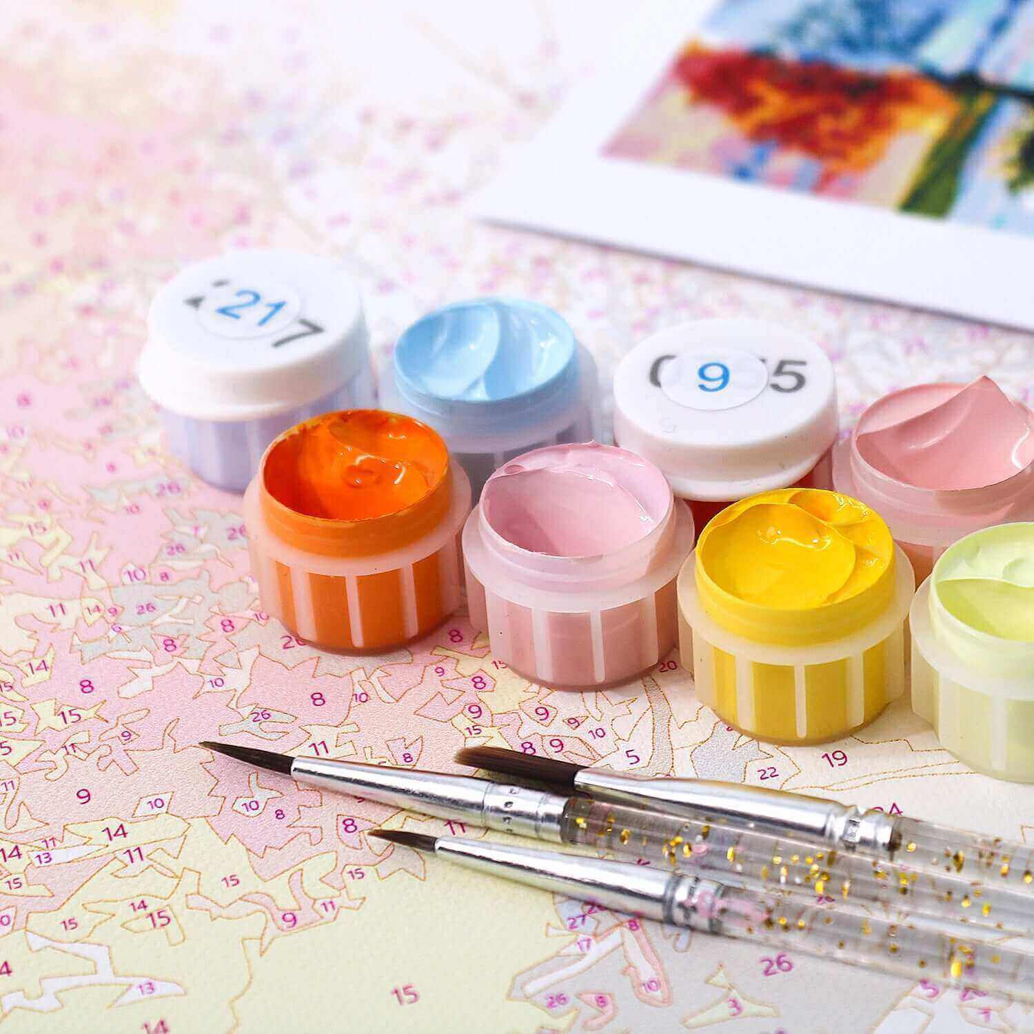 Autumn Whisper Mandala Paint by Numbers kit featuring paint pots and brushes on a numbered canvas.