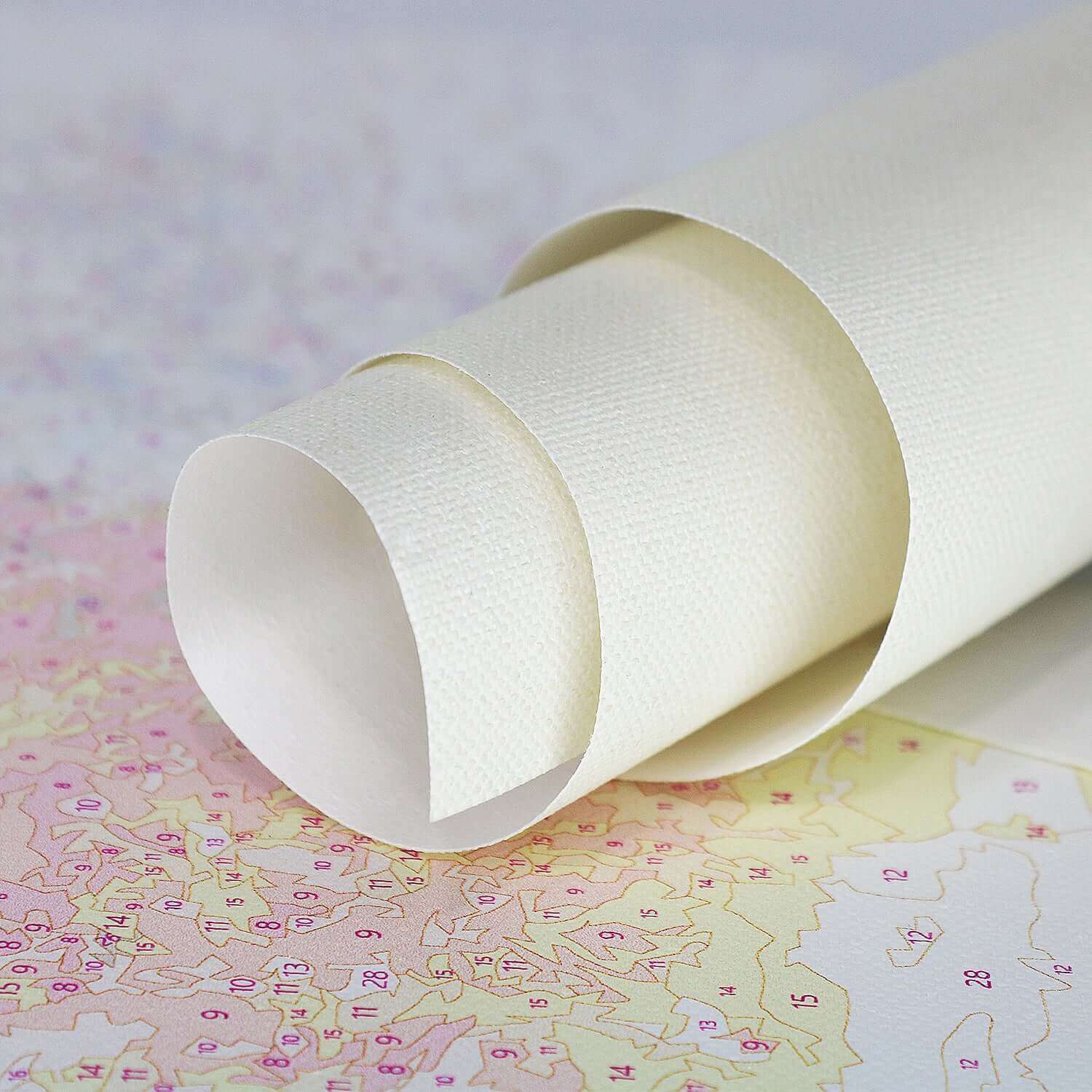 Paint by numbers kits blank canvas rolled up, ready for creative projects and artwork.